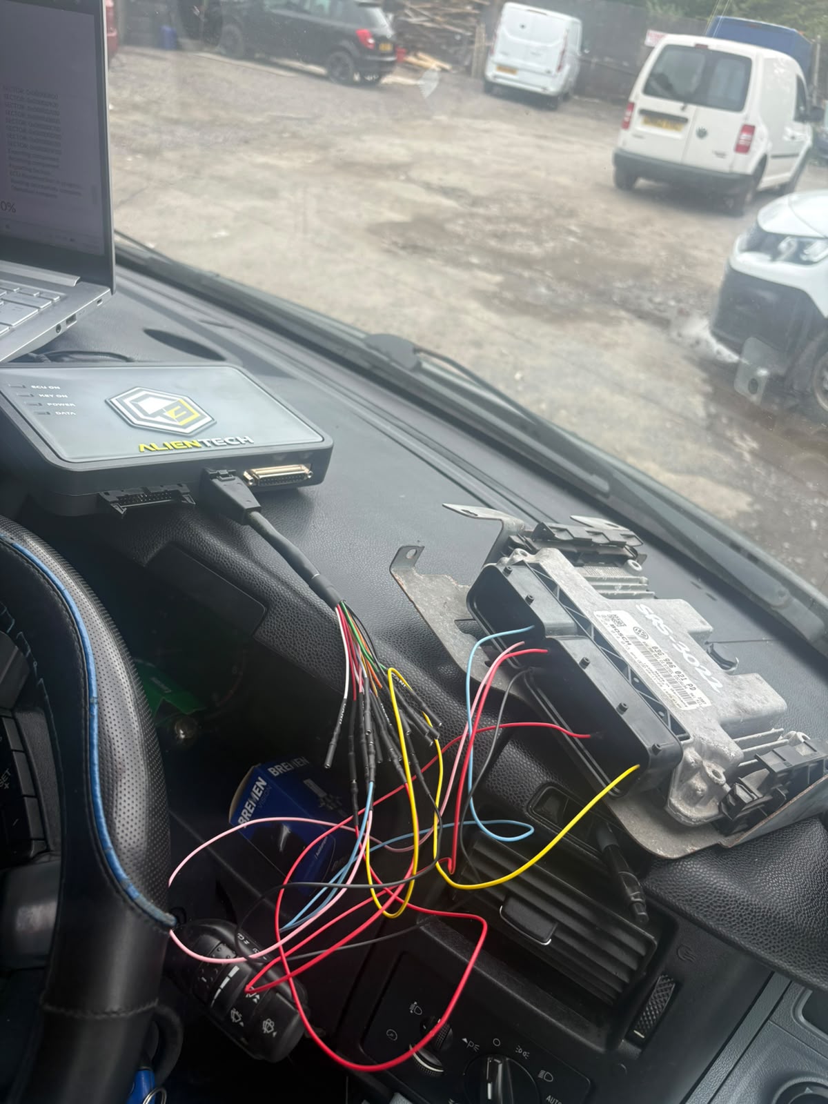 ECU bench remap laid out on vehicle interior